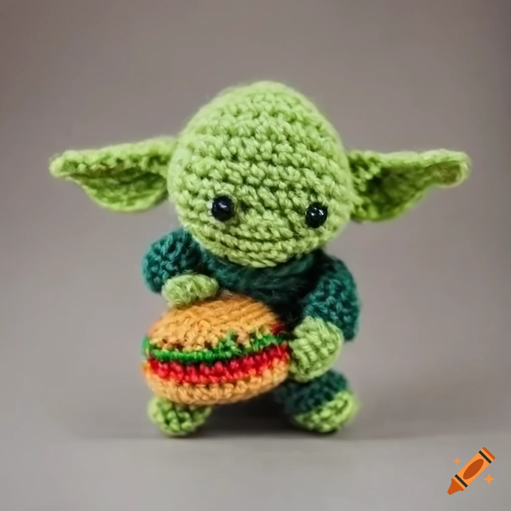 Yoda amigurumi figure holding a hamburger