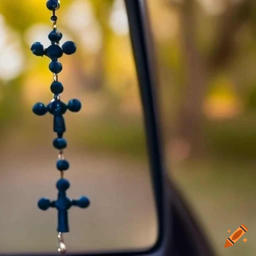Rosary and cross hanging on car mirror on craiyon
