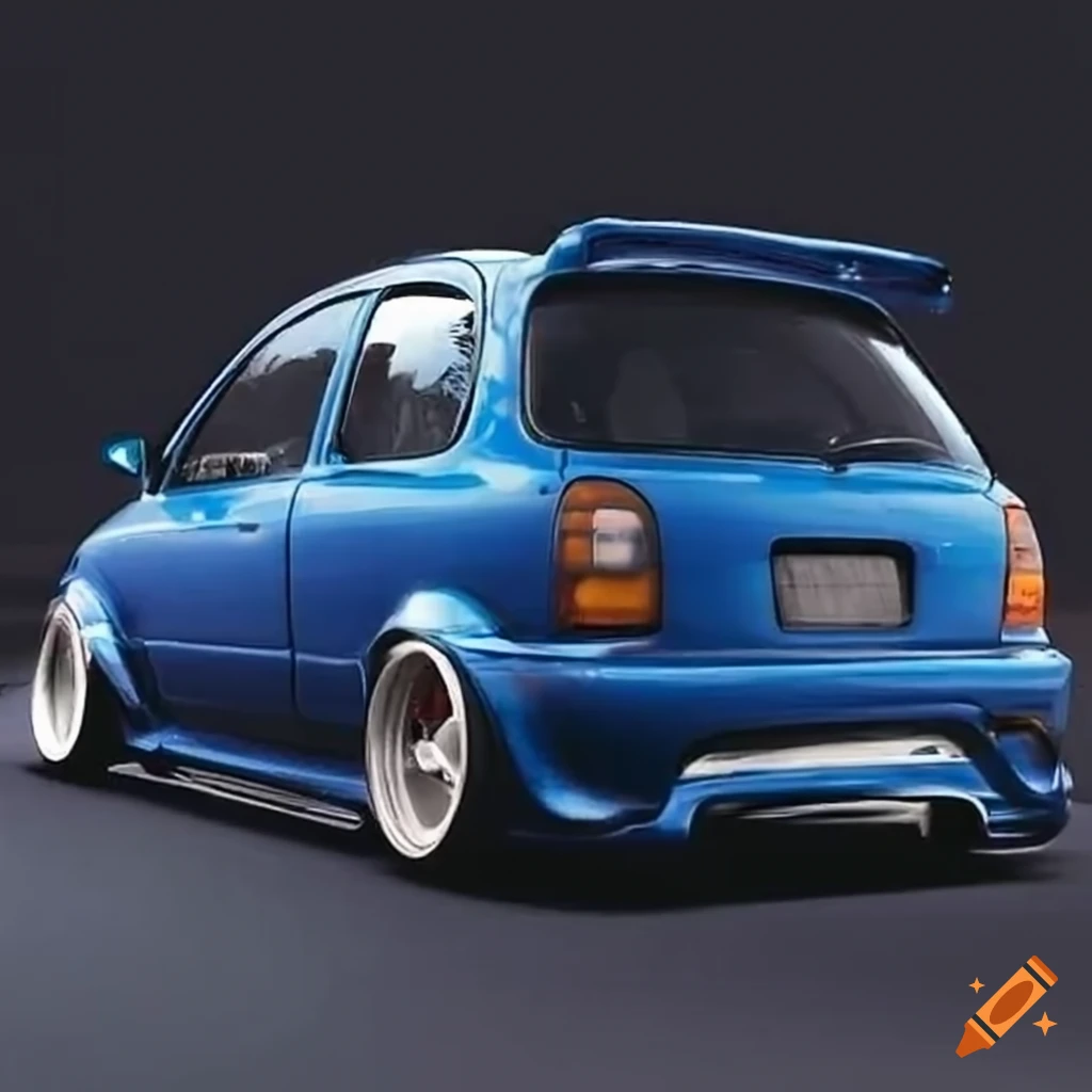 Modified blue nissan micra with wide body kit and large spoiler on