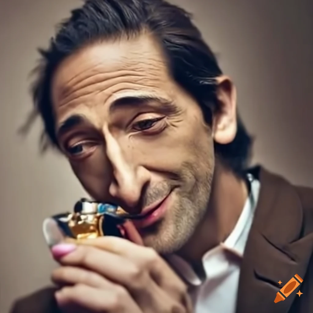 Adrien Brody smelling a luxurious fragrance