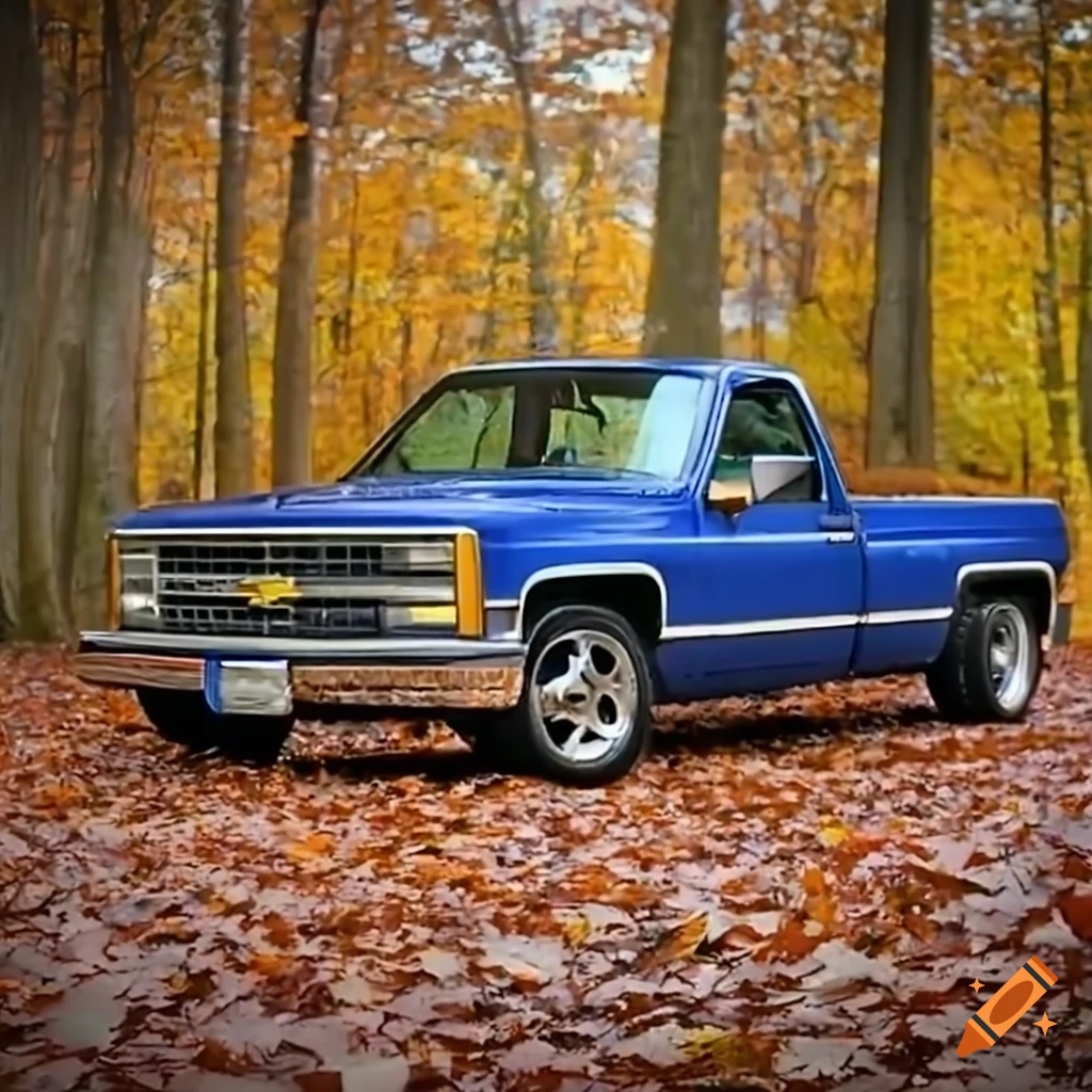 1988 Chevrolet C/K 1500 driving through a forest with autumnal leaves in the rain