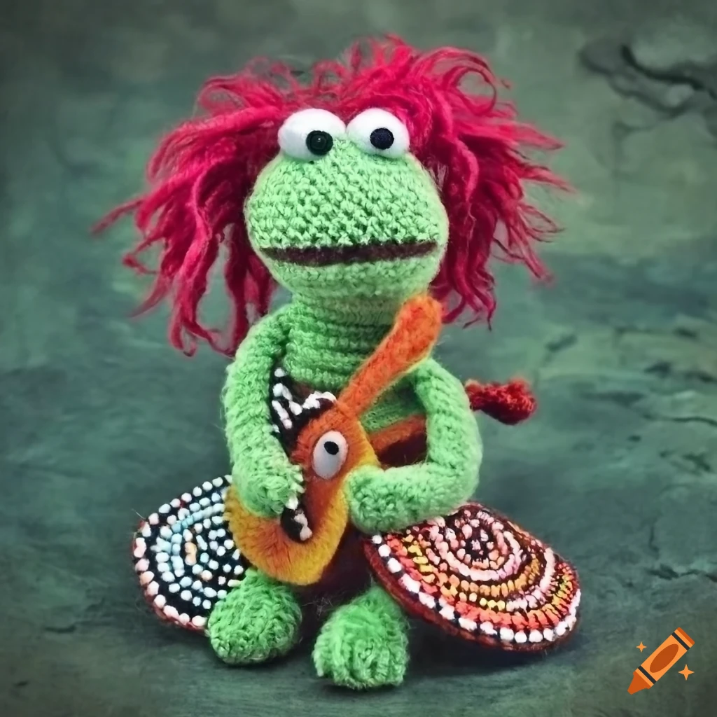 Fraggle Rock muppets crochet plush rock band with Australian Aboriginal art on green concrete background