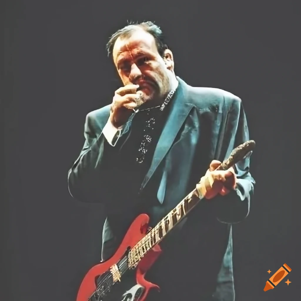 Tony Soprano playing electric guitar at a retro pop gig