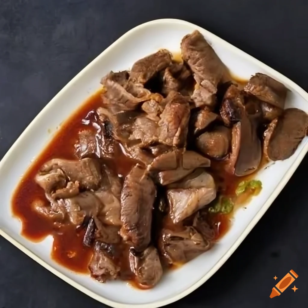 Dish of ripe pork liver mixed with shallots, roasted rice, fish sauce, sugar, and lemon cayenne pepper