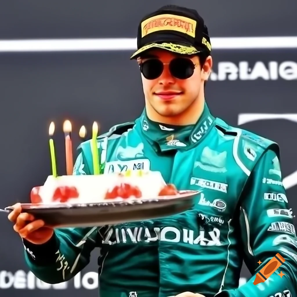 Formula 1 driver Lance Stroll in Aston Martin overall holding birthday cake