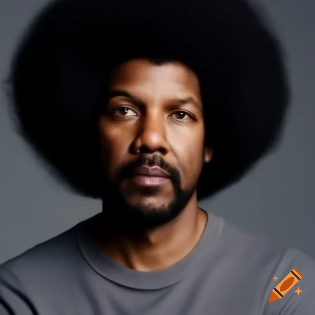 Denzel Washington with afro hairstyle in grey long-sleeved shirt against grey background