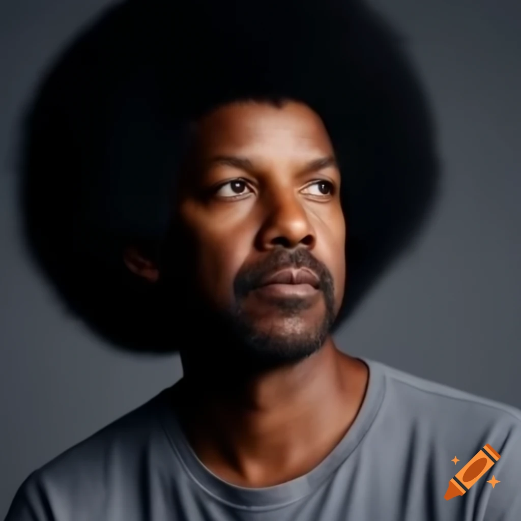 Denzel Washington with afro hairstyle in grey long-sleeved shirt against grey background