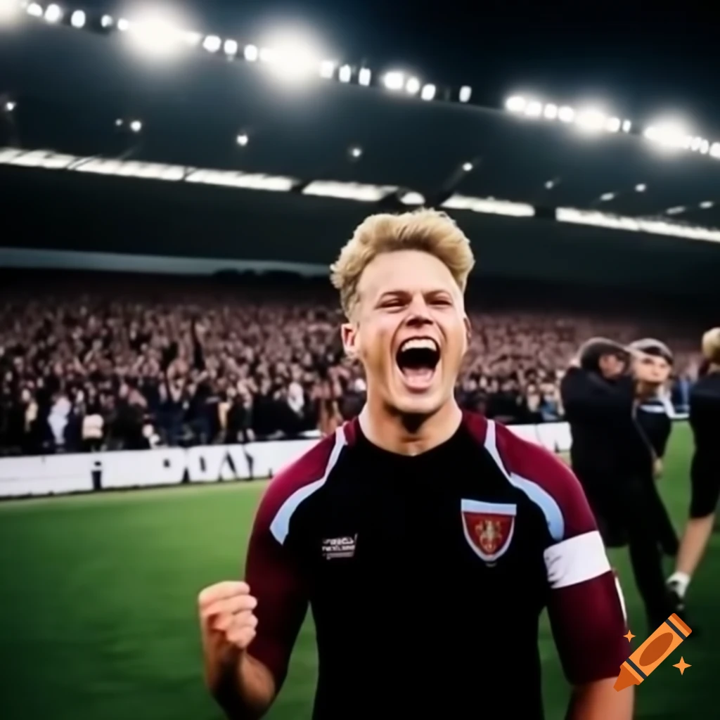 West Ham football player number 8 celebrating in front of large crowd