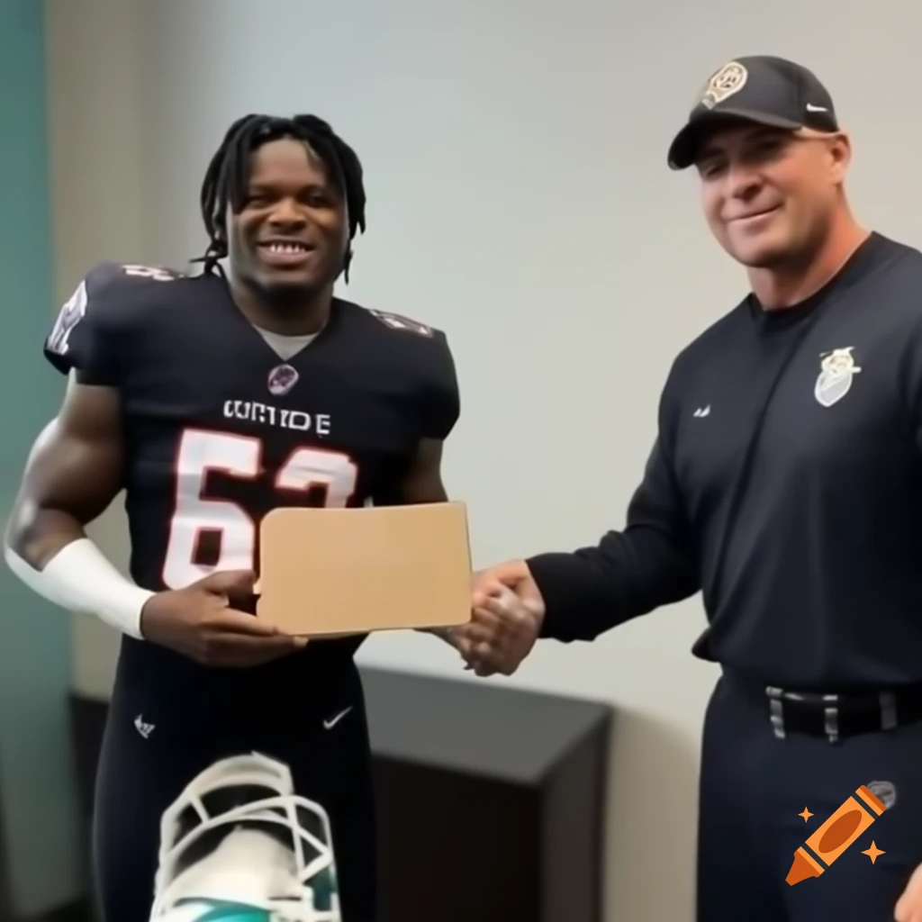 Black football player Tyrel Hill receiving a giant check from Miami police