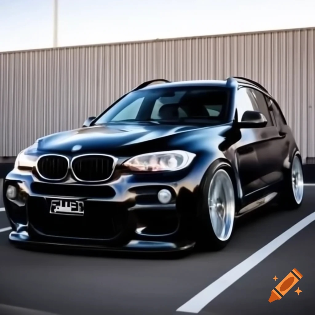 2012 BMW X1 xDrive 20d in black with silver rims in parking lot
