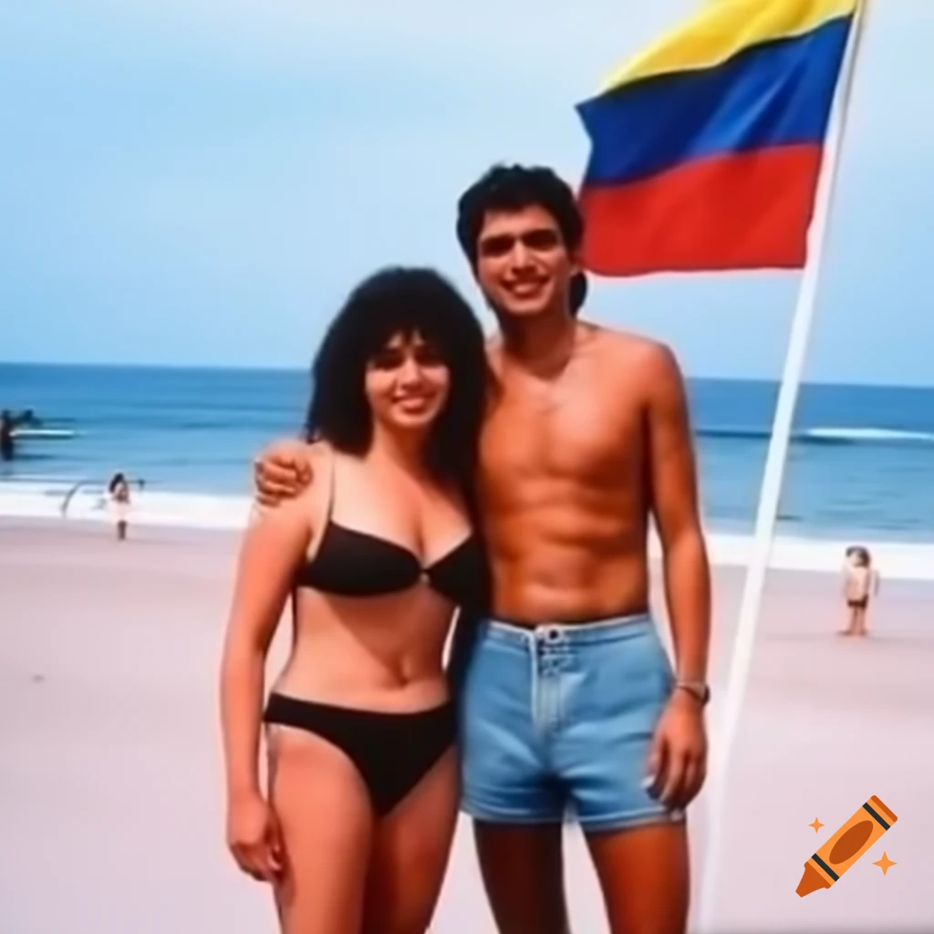Couple standing on beach with Colombian flag in background, 1994