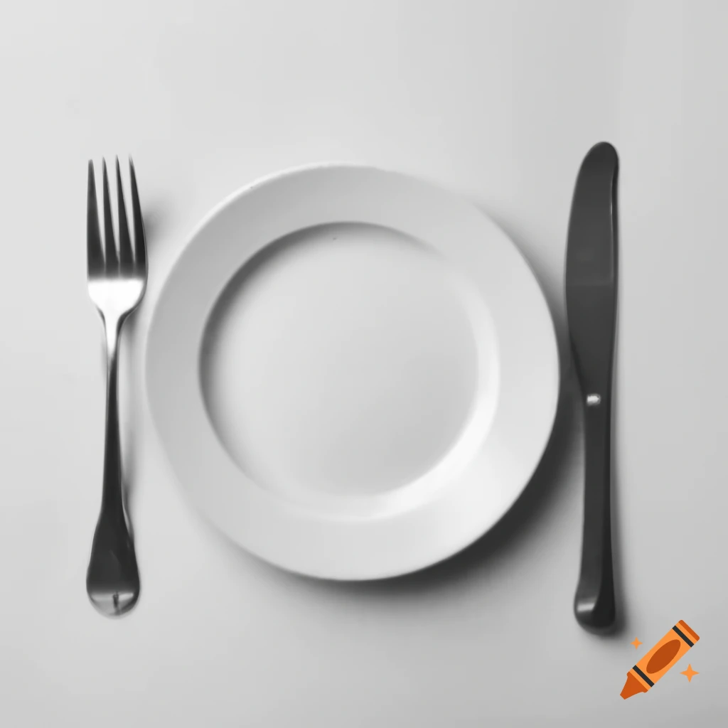 Empty plate with spoon and fork on either side